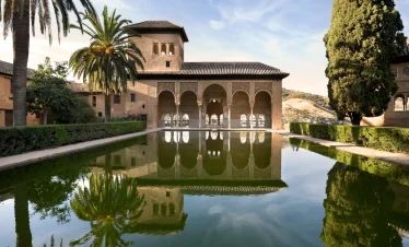 Alhambra Palace reflecting pool and Moorish arches in Granada Spain