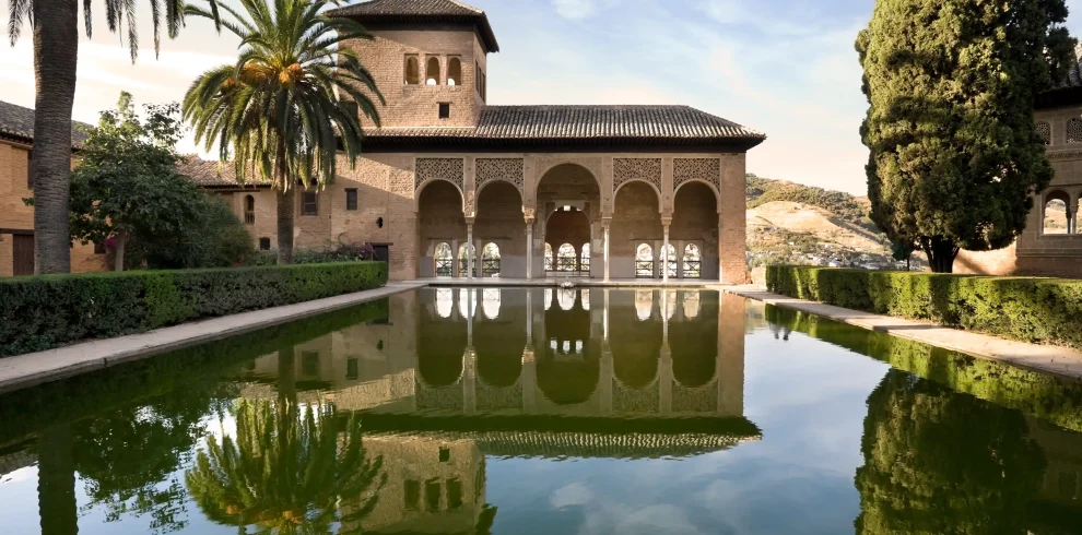Alhambra Palace reflecting pool and Moorish arches in Granada Spain