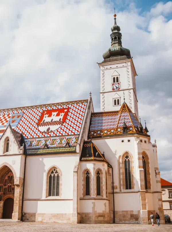 St. Mark’s Church in Zagreb, Croatia, with its vibrant tiled roof showcasing historic coats of arms — a must-see stop on IzzyTrip’s Croatia tours.